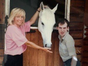 Kate and Michael as young adults at the stable