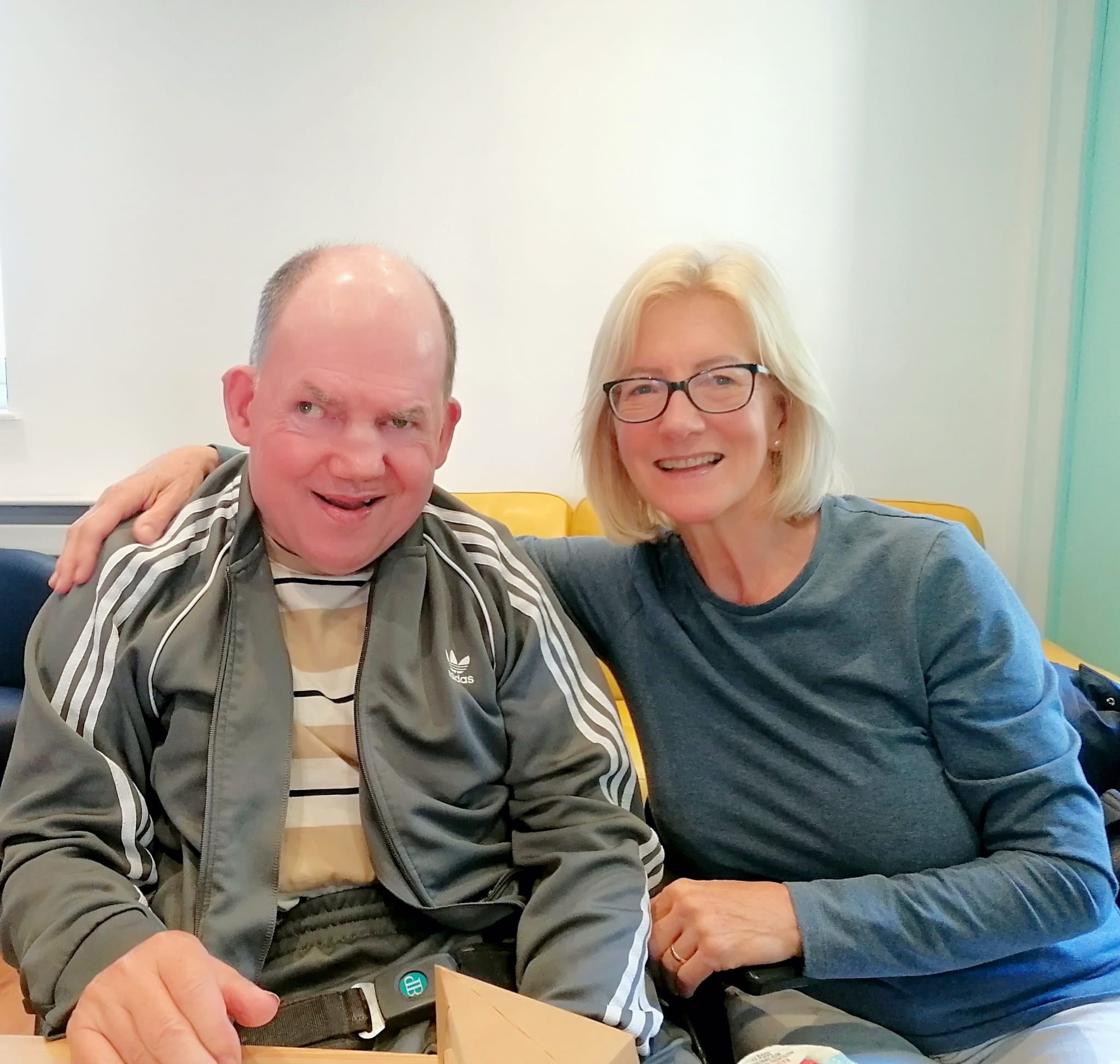 Michael in his new track suit smiling next to his sister at The Meath